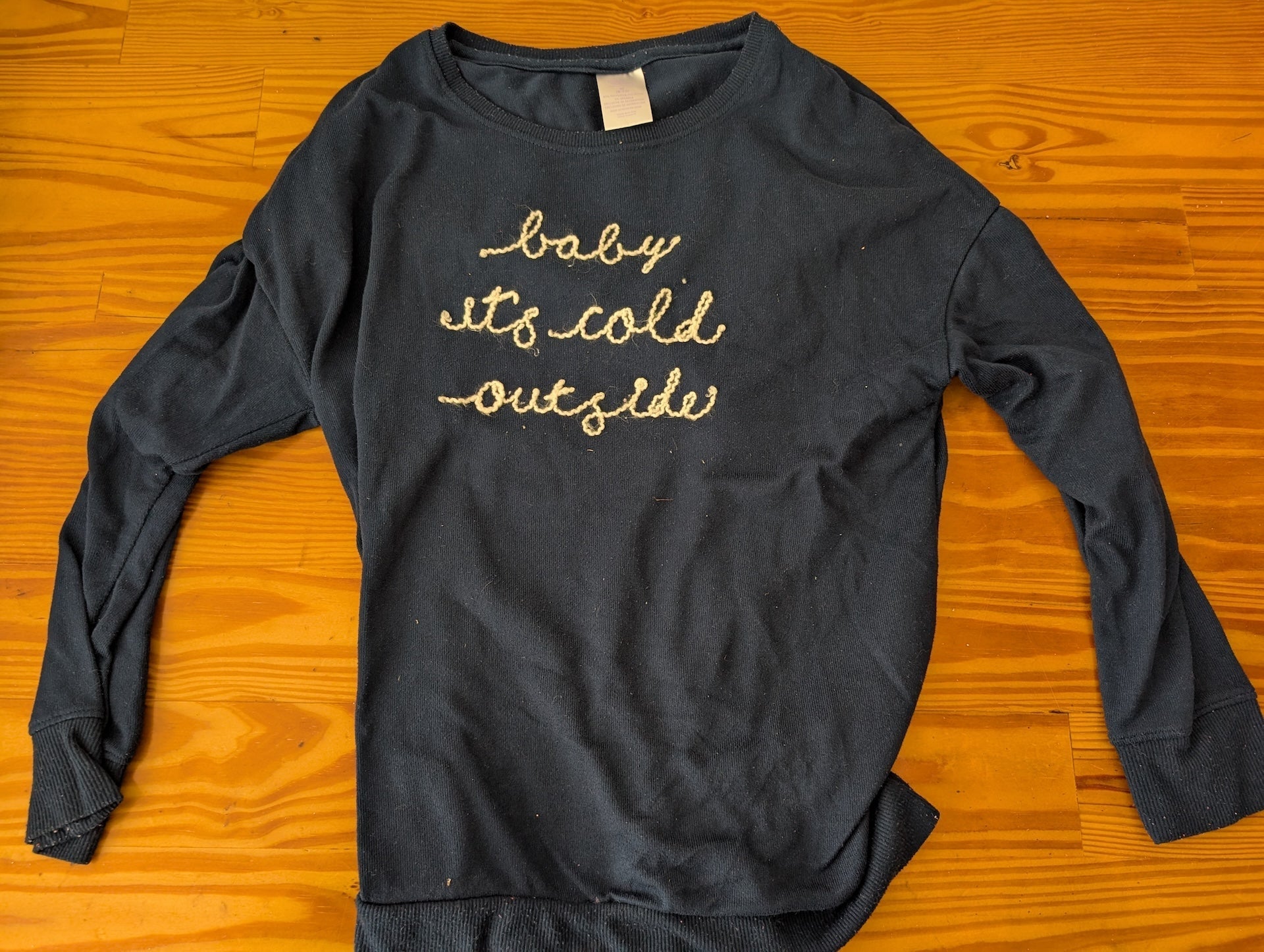 "baby it's cold outside" Sweatshirt from Unknown -  Apparel (Cotton/Poly Blend Sweatshirt, Winter, Cozy, Navy Blue, Gold)